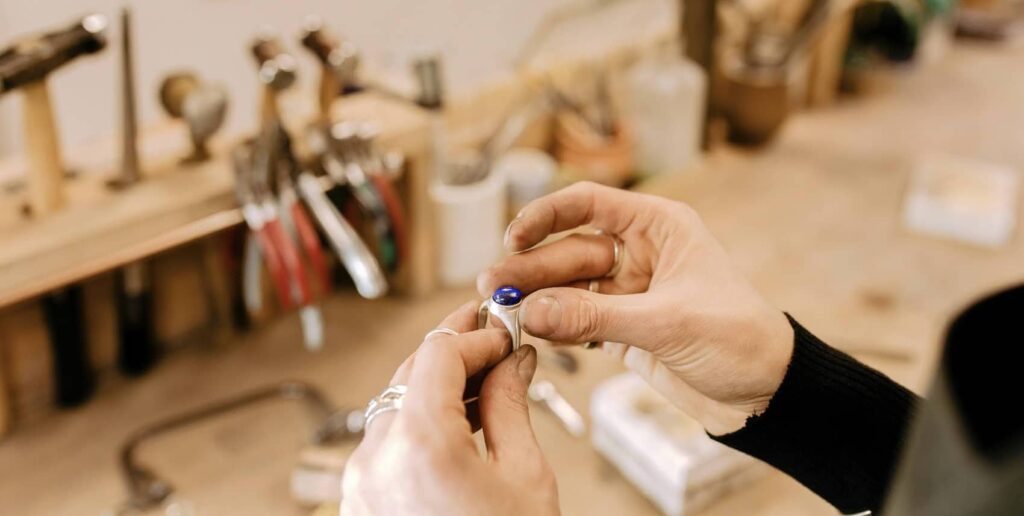 Adrienne Wroath working on a ring