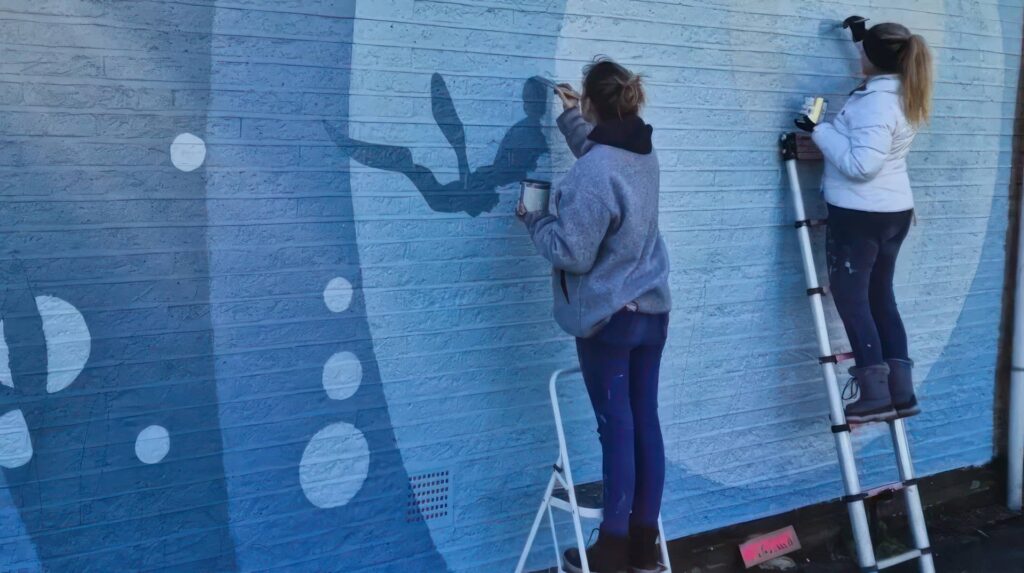 Artists added mural at Waterisde Pool