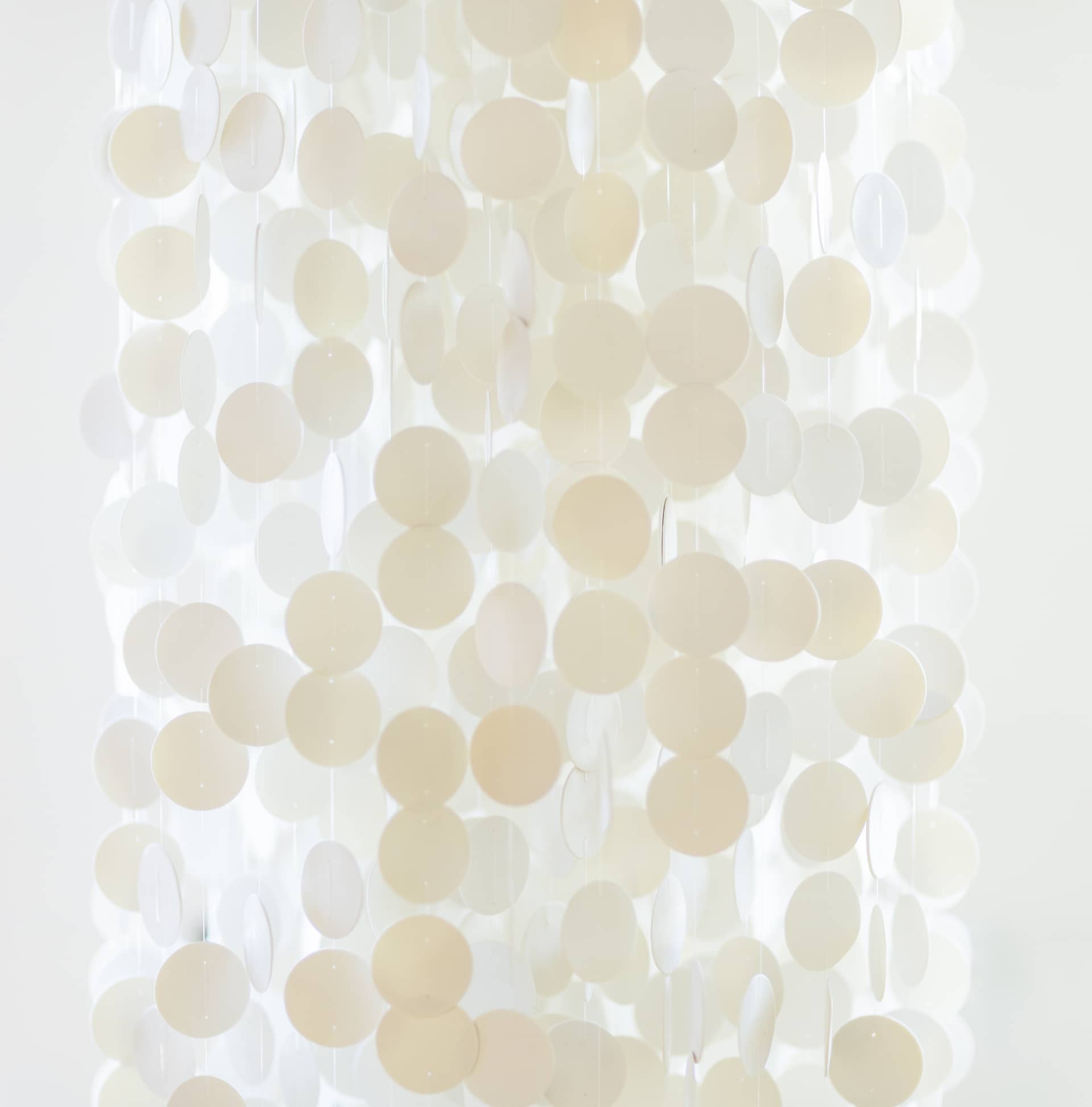 2,000 white ceramic discs hanging in the chapel