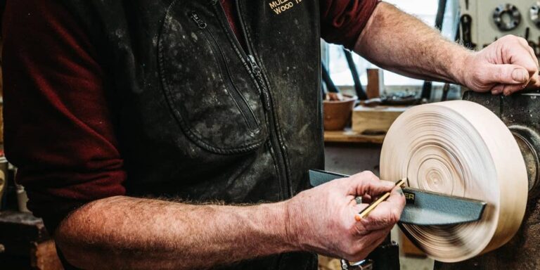 Craft maker from Mulberry Tree Wood Turning marking up the base of a bowl