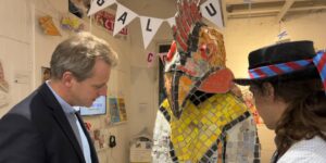 Joe Robertson and Joel Lines looking at Gallus outfit in the Hats off to Sandown exhibition