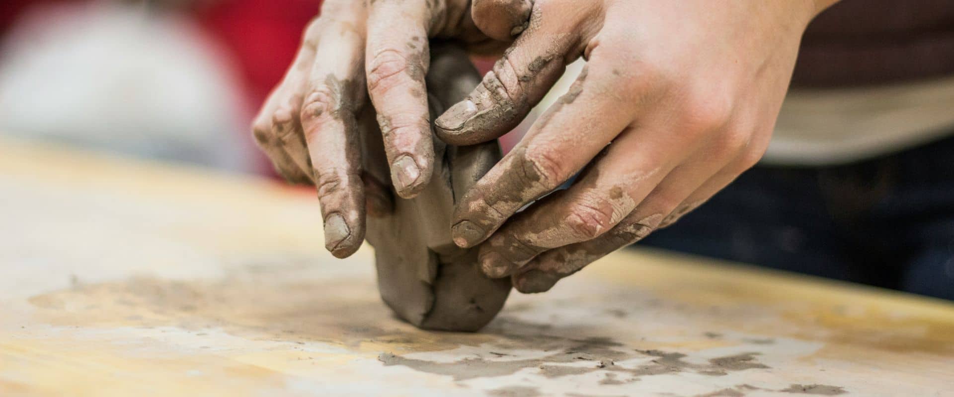 A potters hands covered in clay