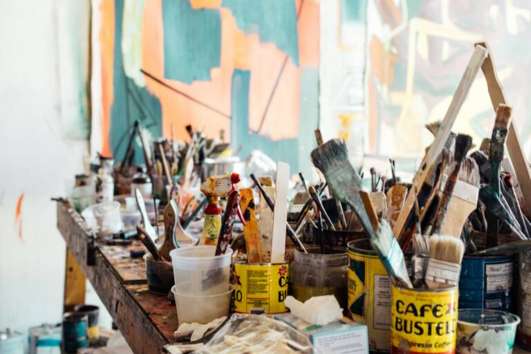 Artist's studio with canvasses and paint brushes