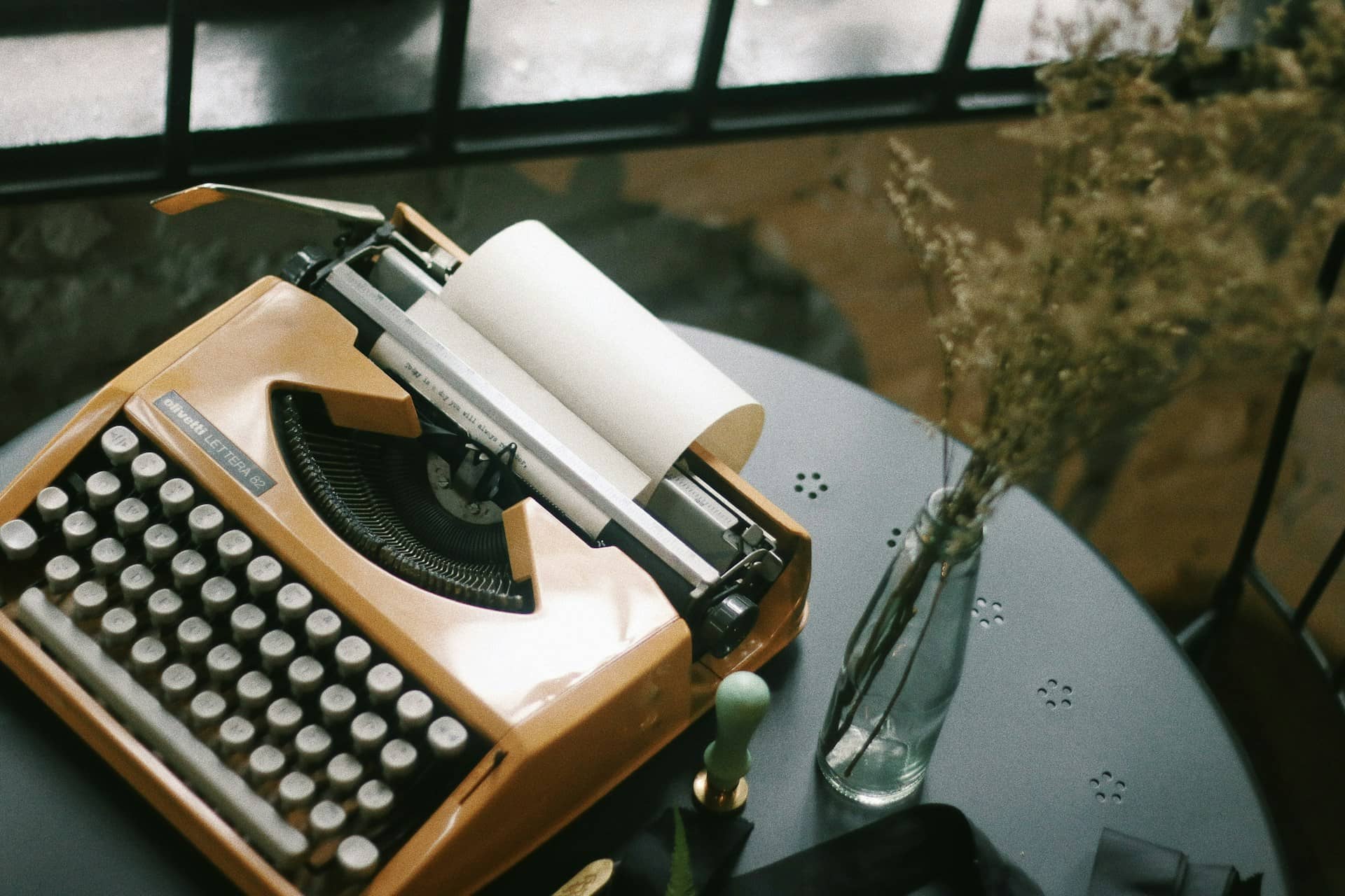 orange typewriter on desk