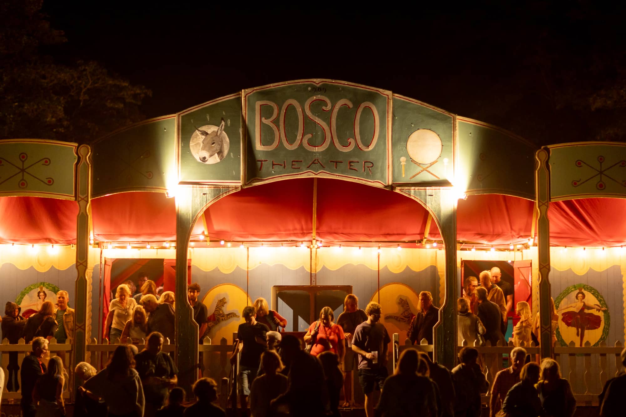 Audience members leaving The Bosco Theatre at night time