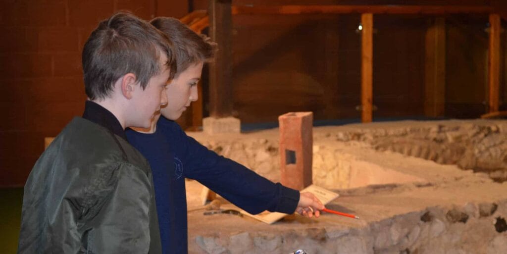 Two pupils discovering Newport Roman Villa