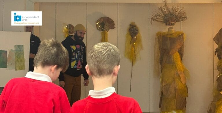 Image showing pupils at Independent Arts exhibition, with Independent Arts logo overlaid on top
