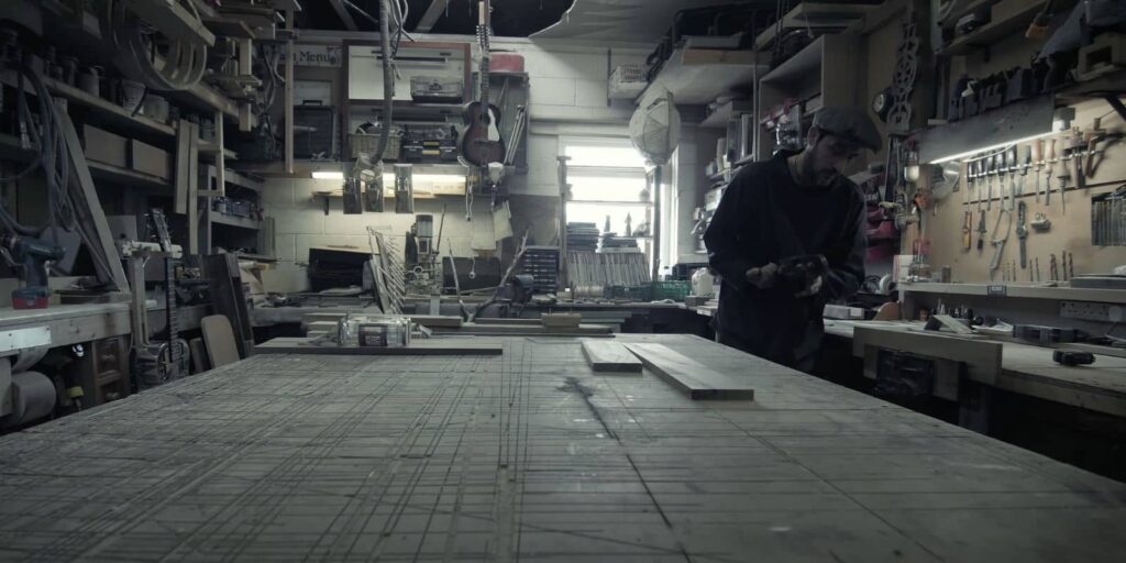 Ollie in his darkly lit studio.