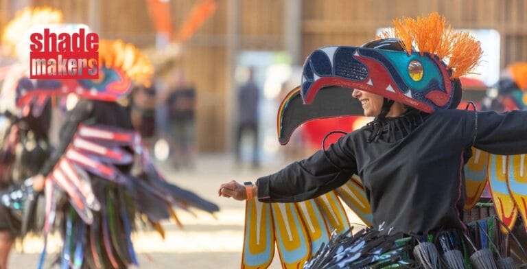 People dressed up in costumes made by Shademakers for the Royal Jubilee Pageant, with Shademakers logo overlaid on top