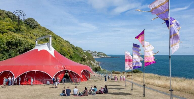 The Ventnor Exchange Arena, Big Top tent, on the field at FlowersBrook with Ventnor Exchange logo overlaid on top