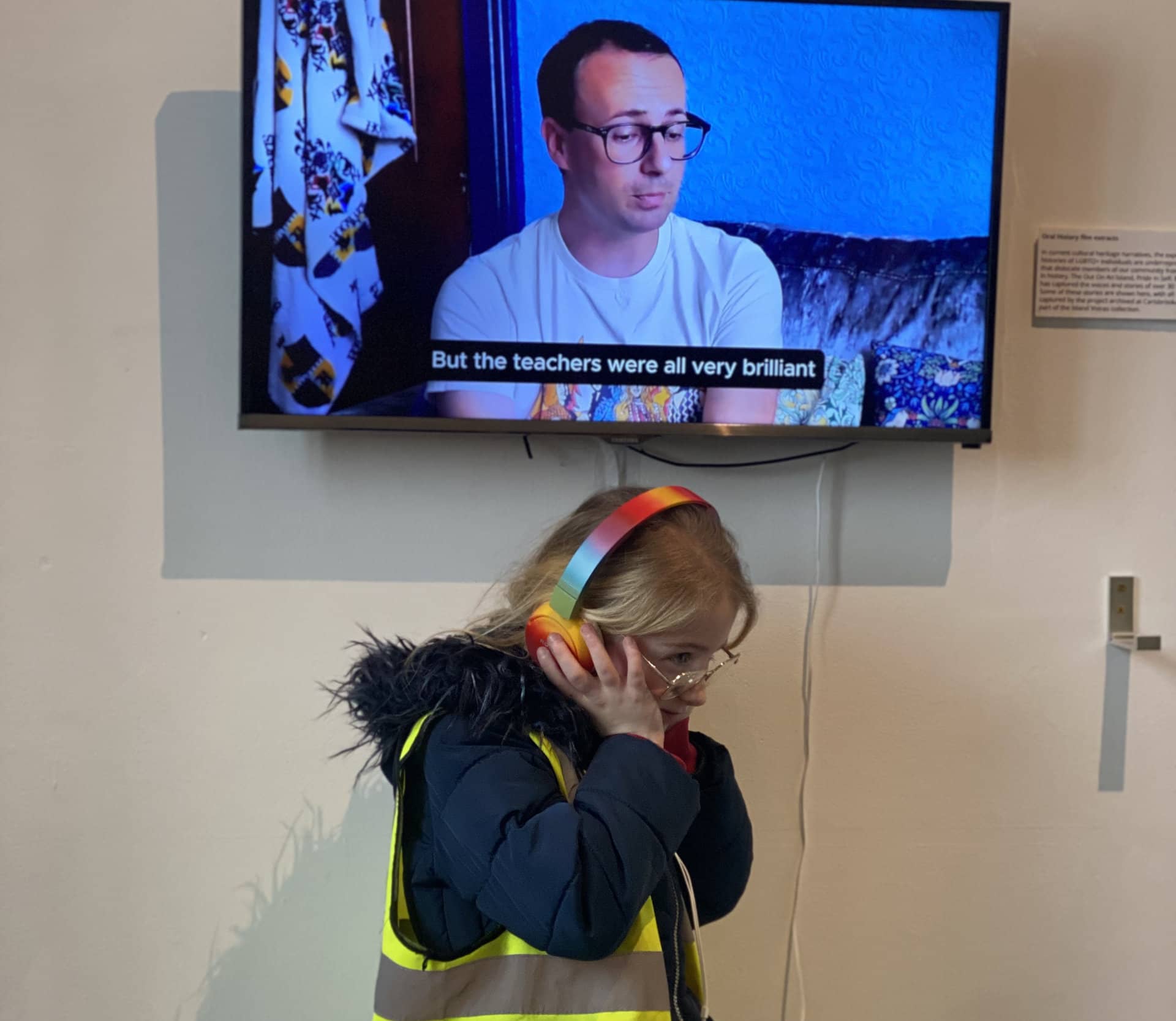 Pupils listening to stories through headphones