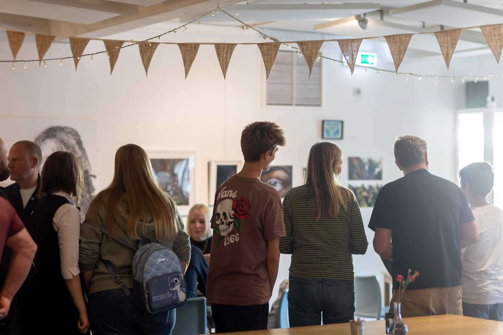 Young people looking at artworks