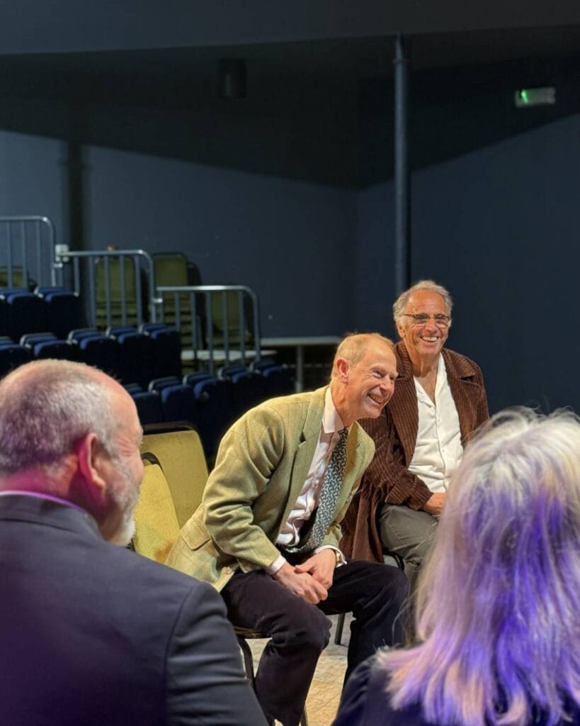 HRH The DUke of Edinburgh and Gavin Stride from Creative Island, laughing in the Anthony Minghella Theatre at Quay Arts.
