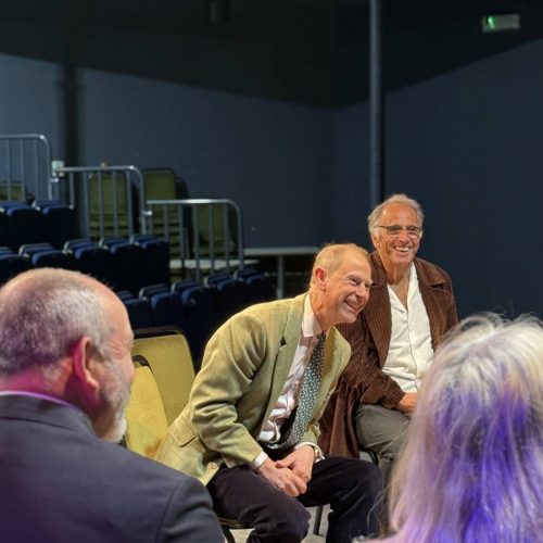 HRH The DUke of Edinburgh and Gavin Stride from Creative Island, laughing in the Anthony Minghella Theatre at Quay Arts.