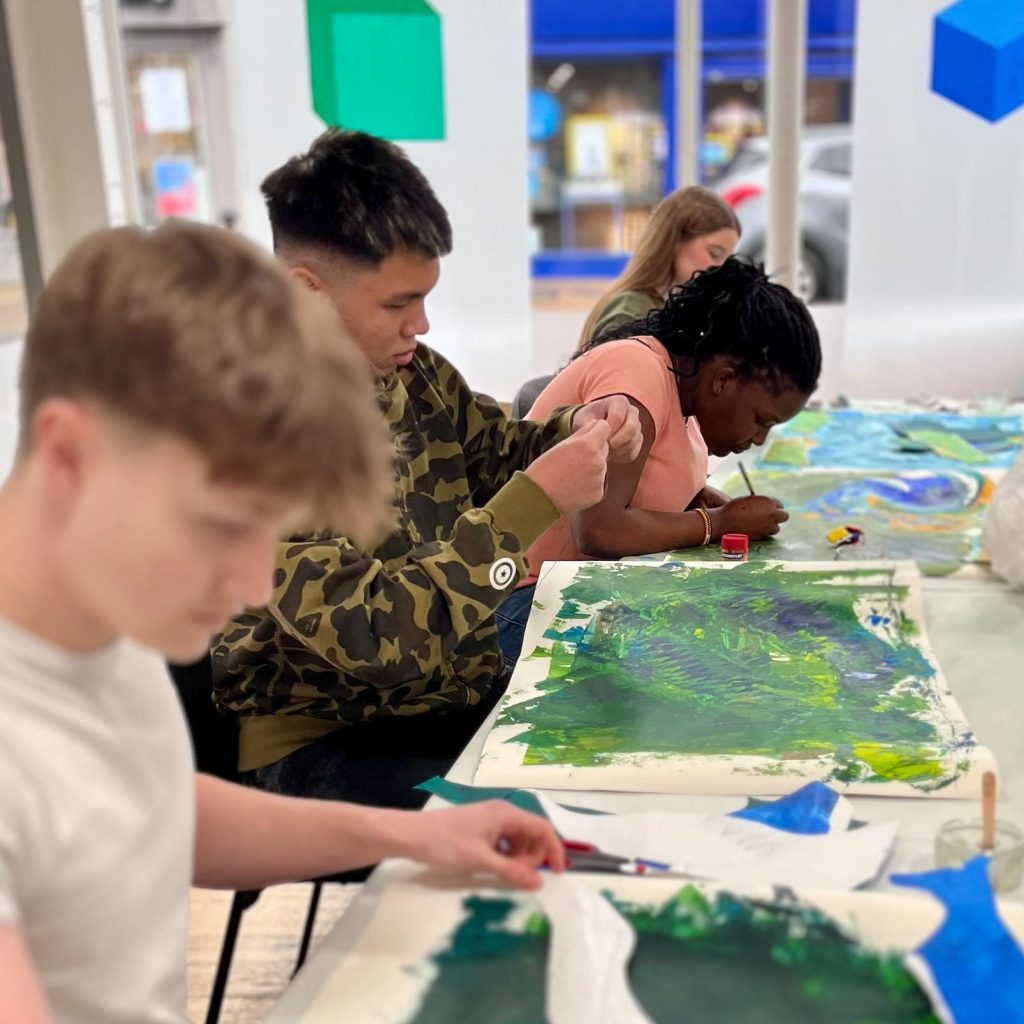 young people painting at independent arts